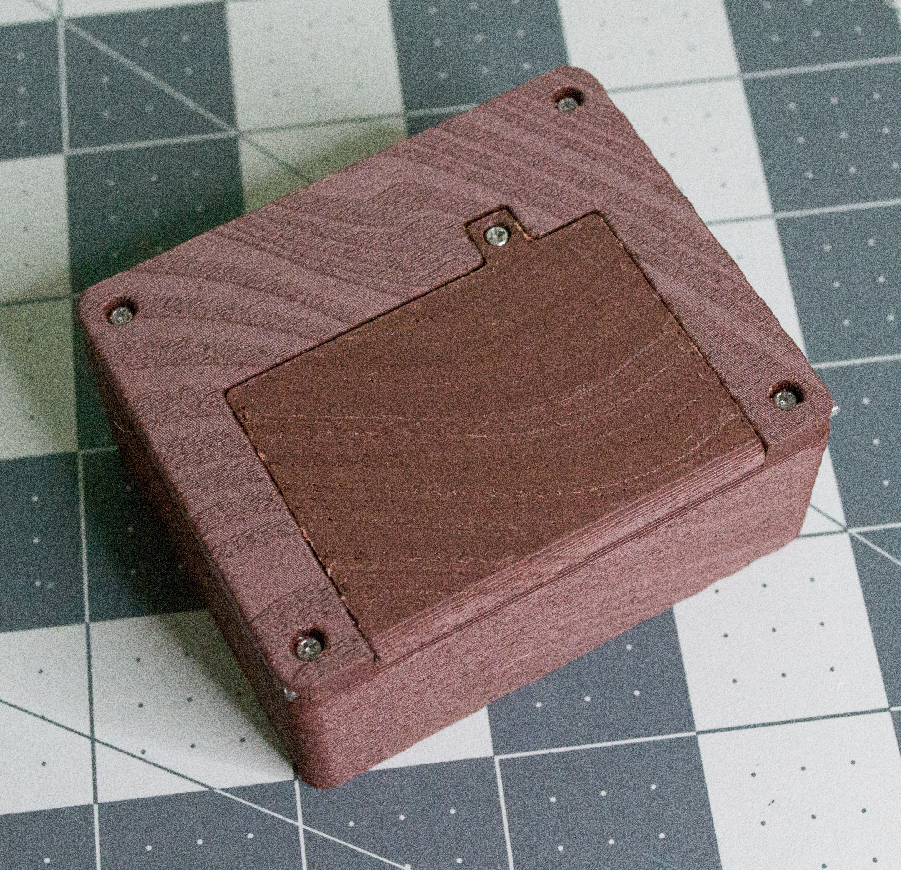 Screwed in screw to hold VintageScale lid closed.