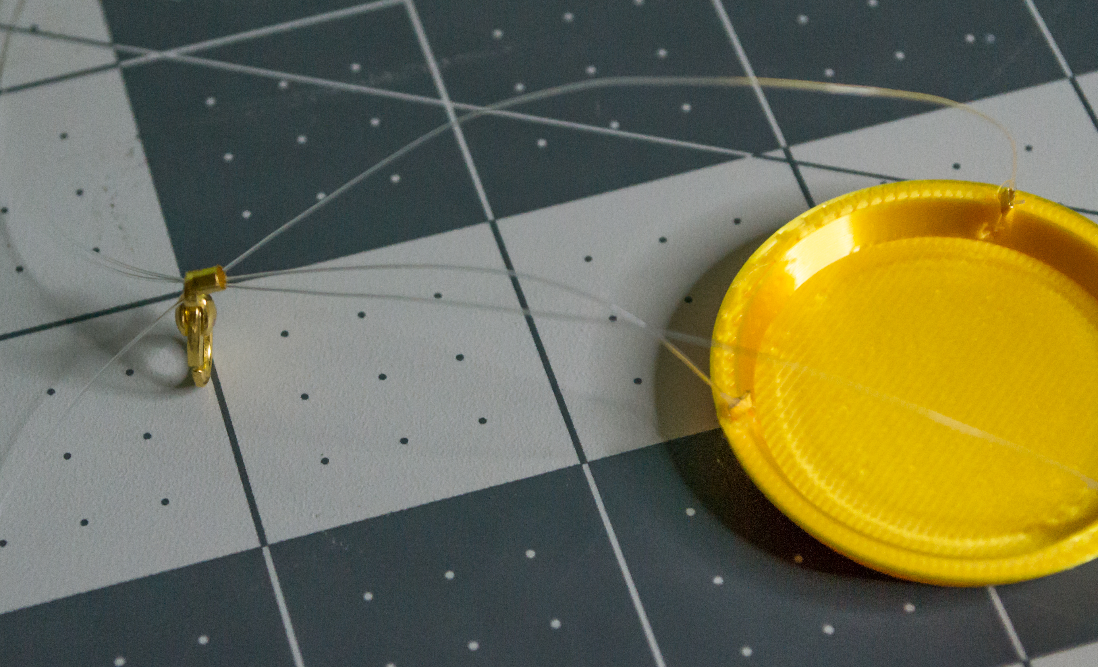 A good view of both parts on the three monofilament lines from the 3D printed gold plates for VintageScale.