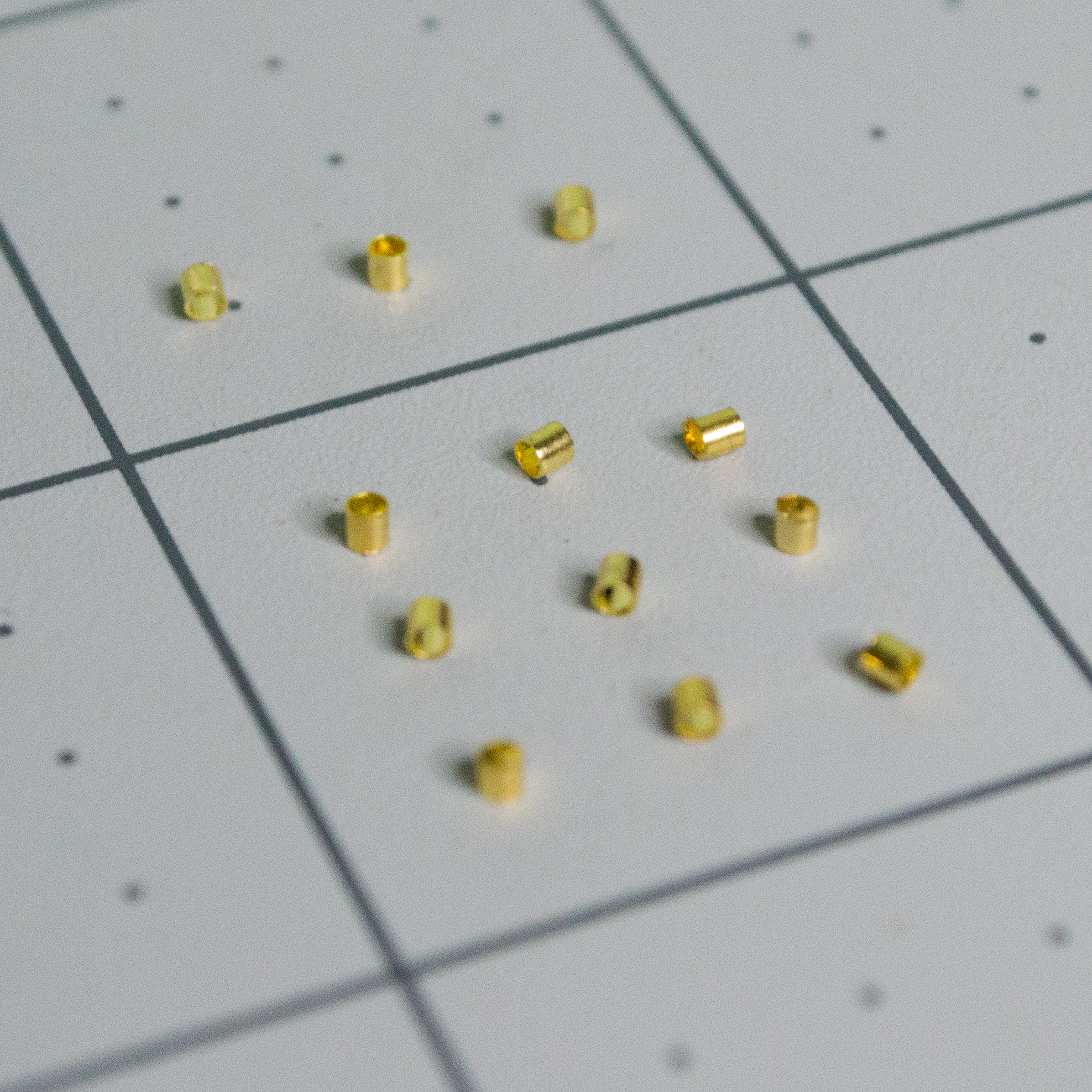 Small gold crimp beads for VintageScale.