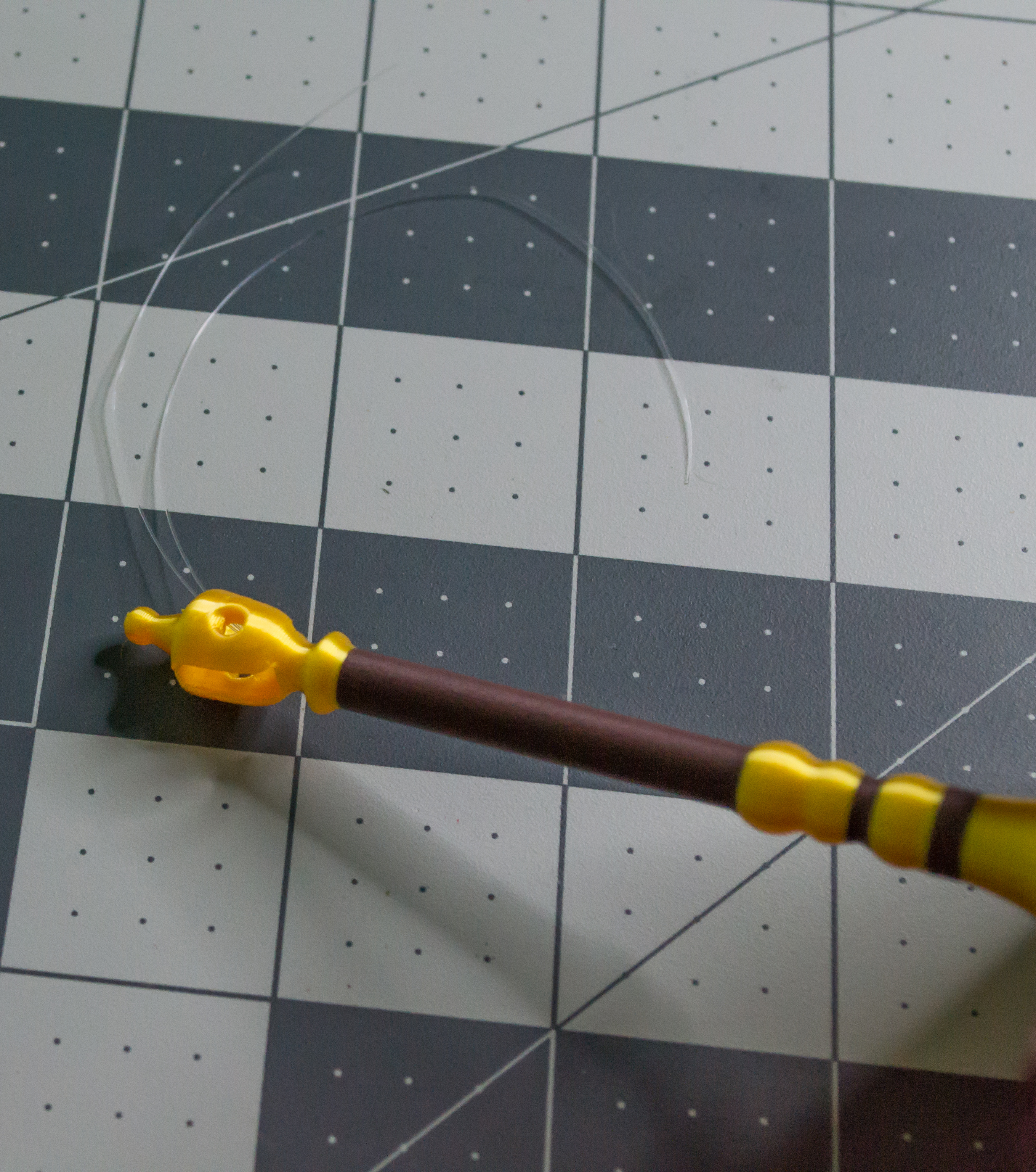 Showing both monofilament lines leaving the top of the scale mast on VintageScale.