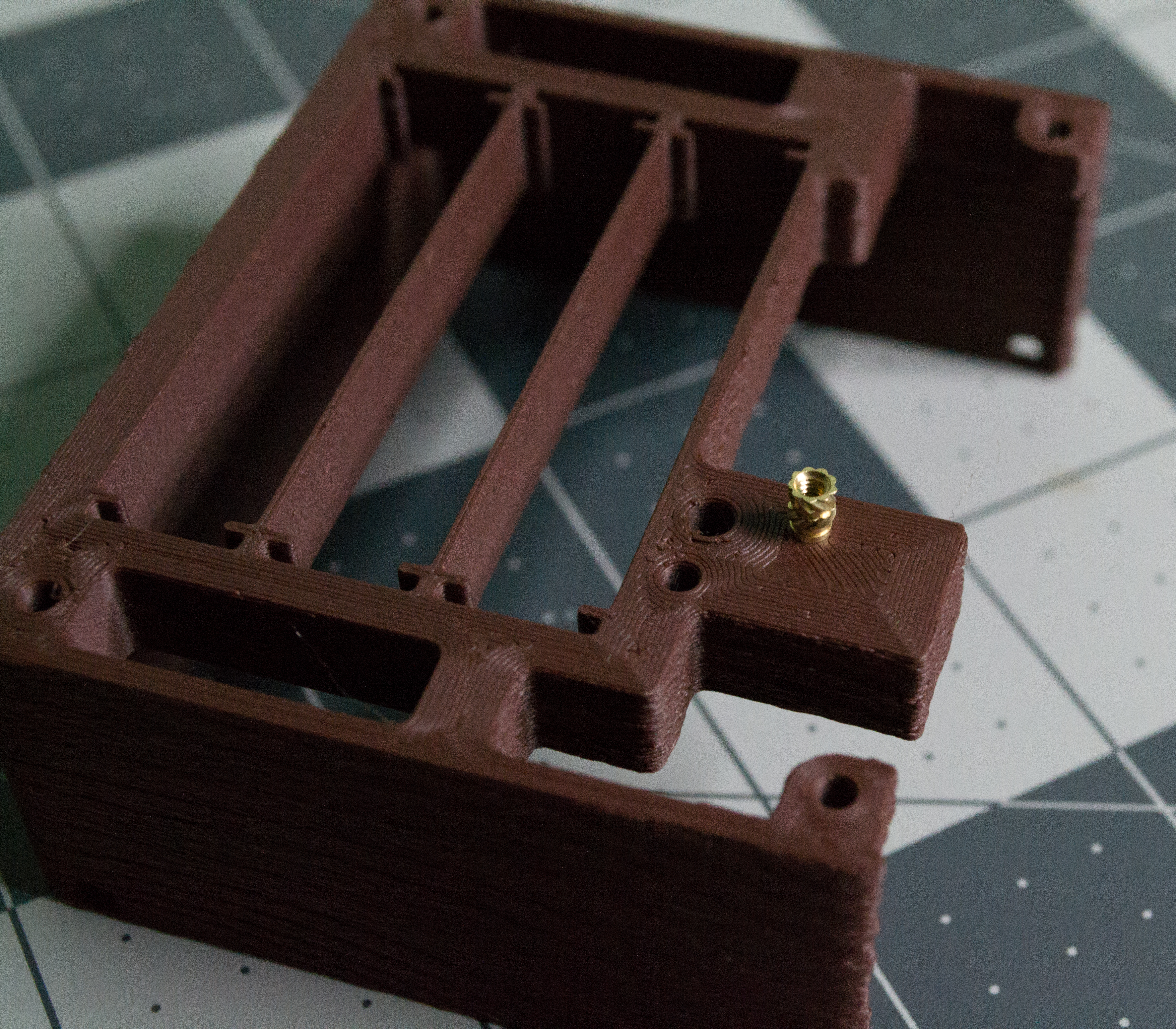 3D printed body component for VintageScale with a threaded insert on top.