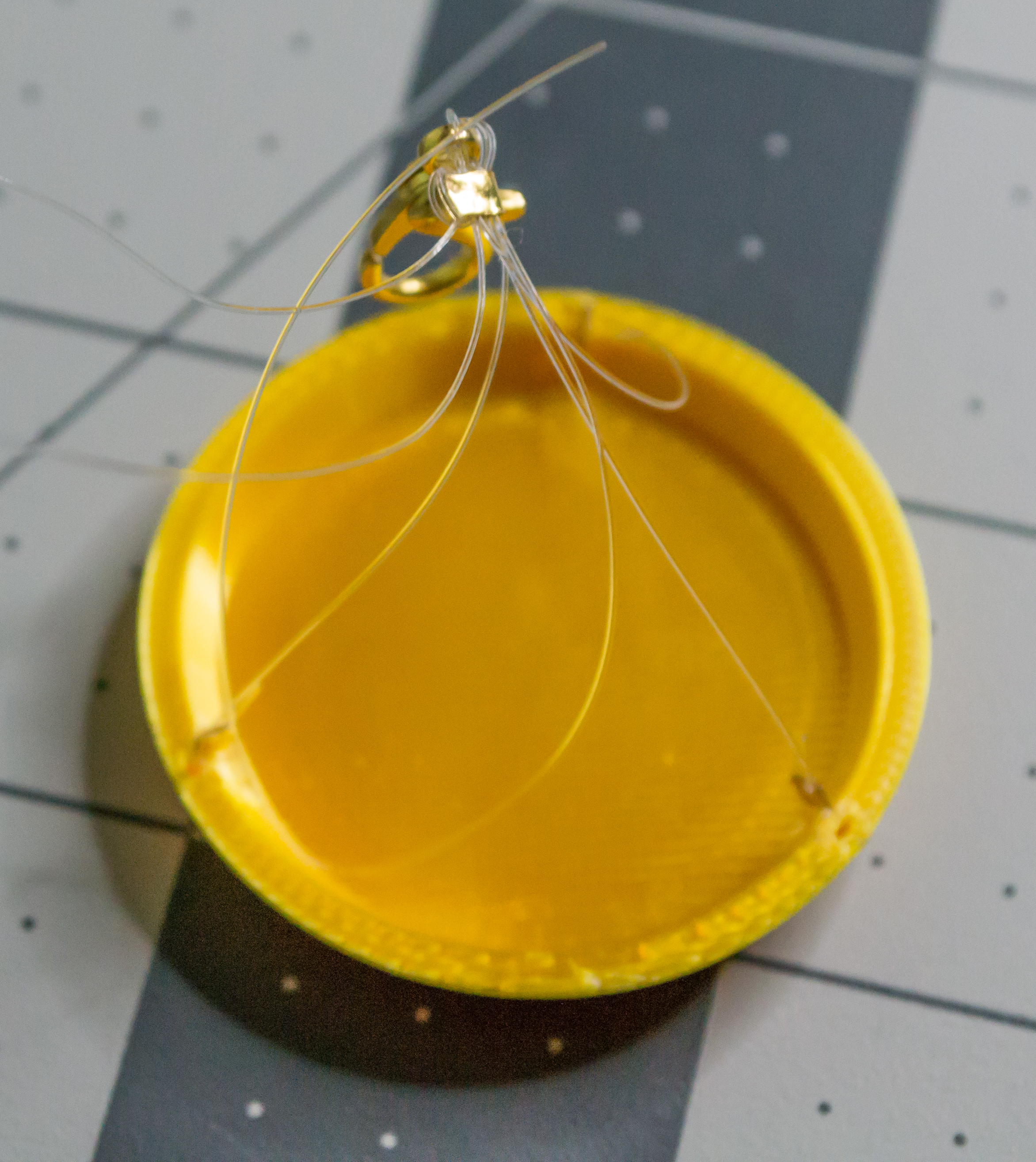 After crimping the gold medium crimp bead for the VintageScale plate.