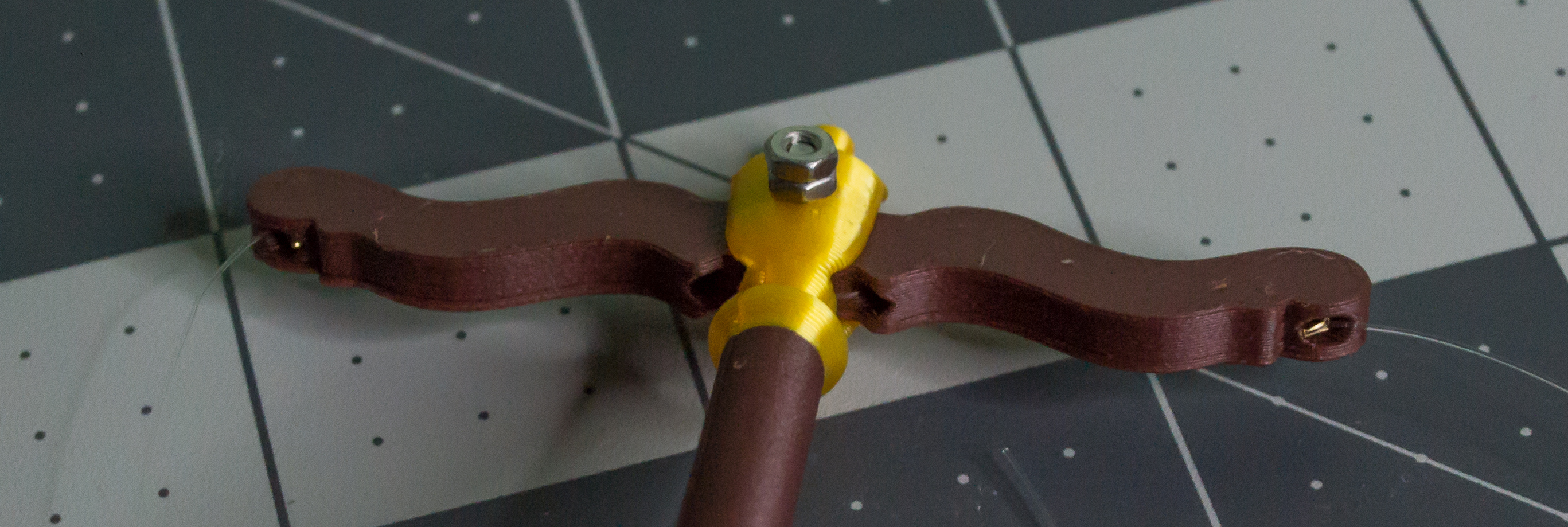 Both small gold beads crimped and inserted into the lever component on VintageScale.