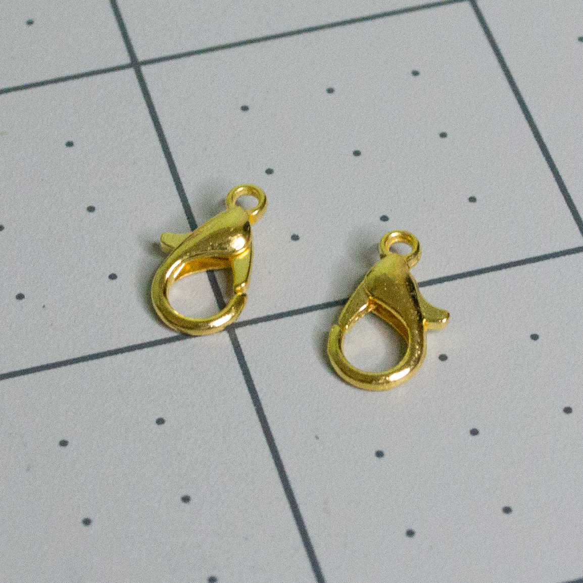 Gold lobster claw clasps for VintageScale hanging hardware.