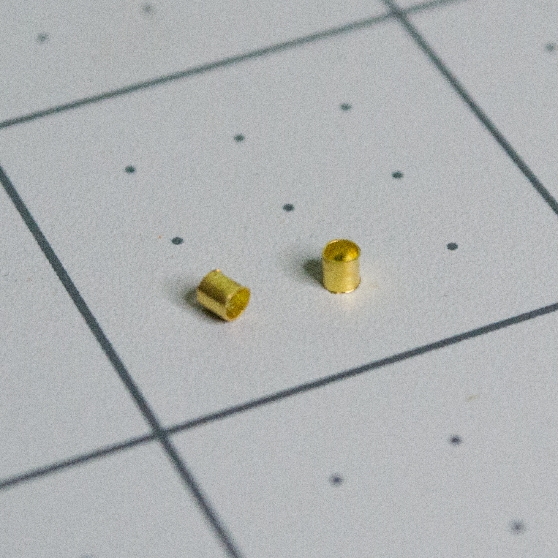 Medium gold crimp beads for VintageScale.