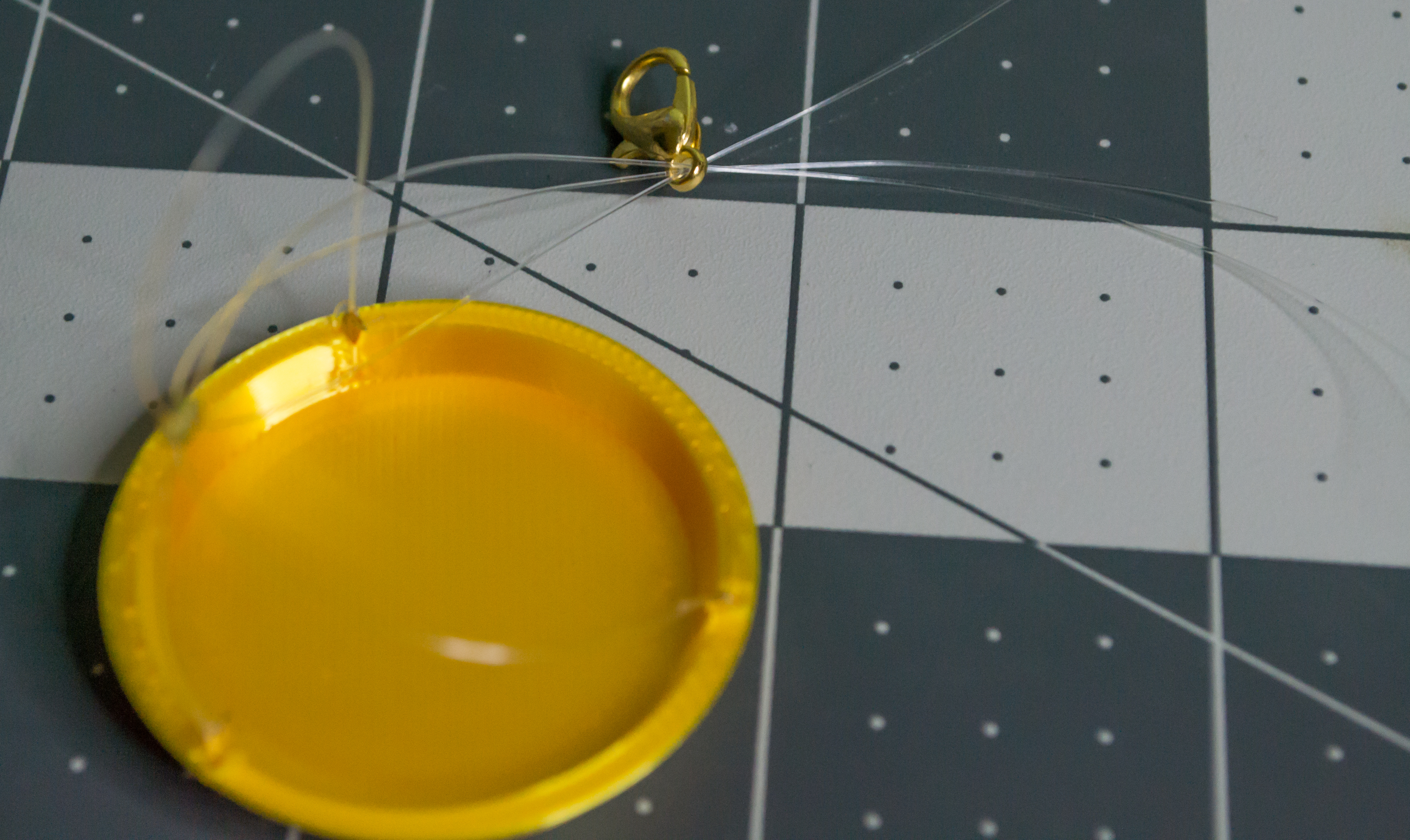 Adding a gold lobster claw after the medium gold crimp bead to VintageScale.