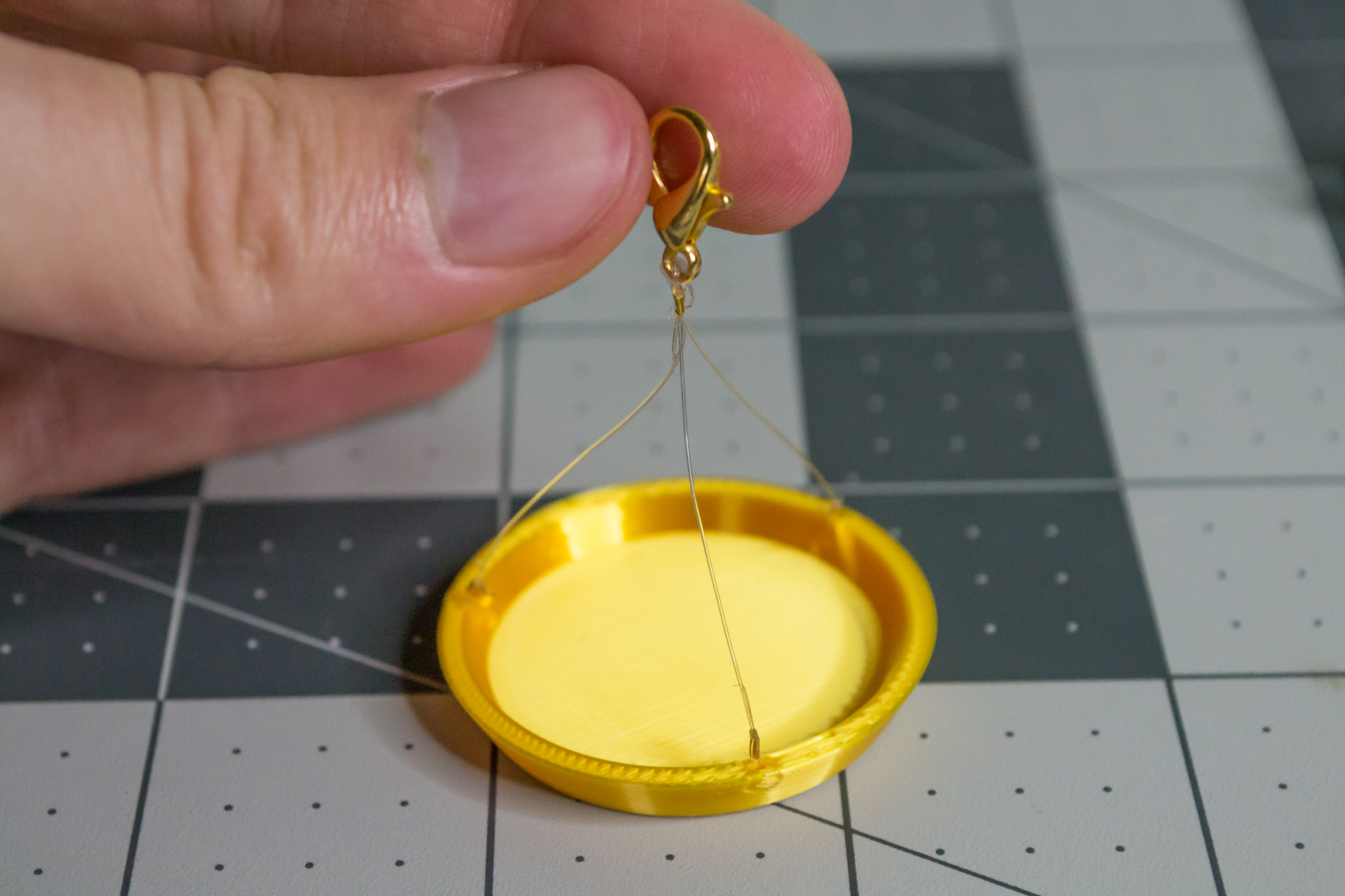 Cutting the excess monofilament line off VintageScale plate.