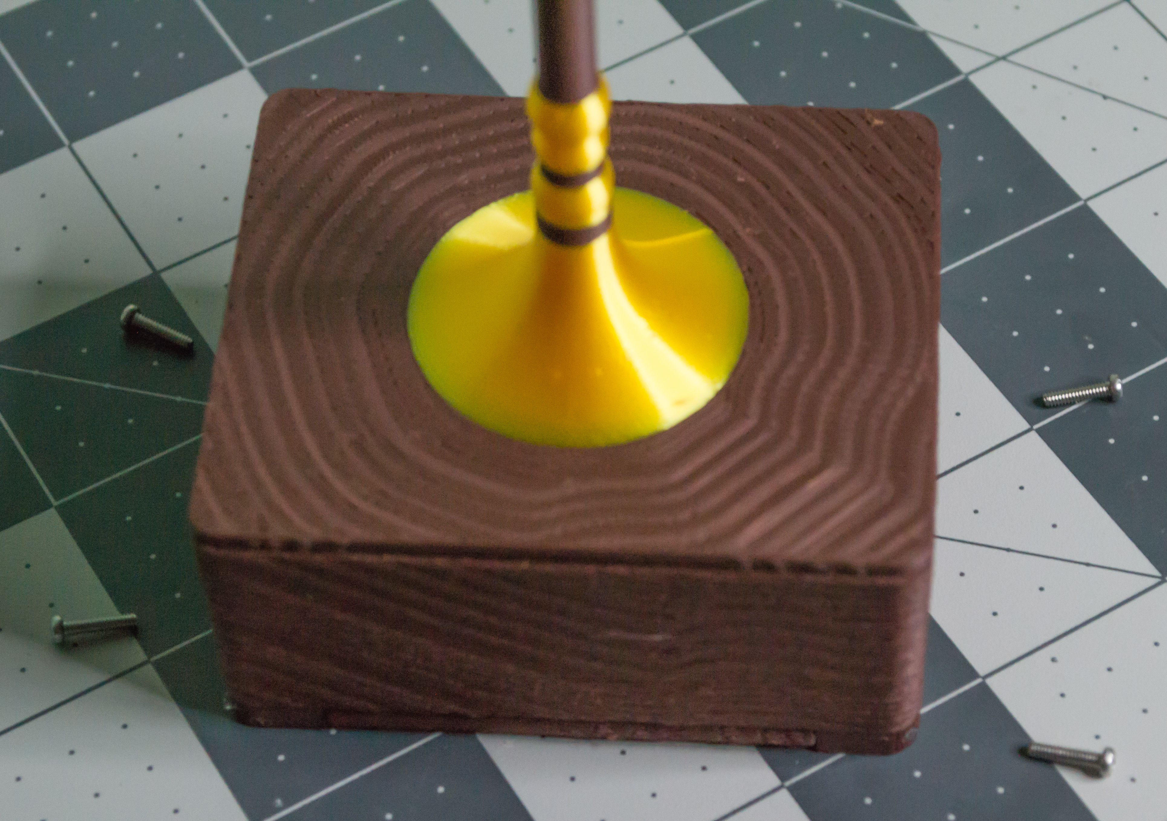 Four M2, 8 mm machine screws ready to attach the Top/Scale component to the Body on VintageScale.