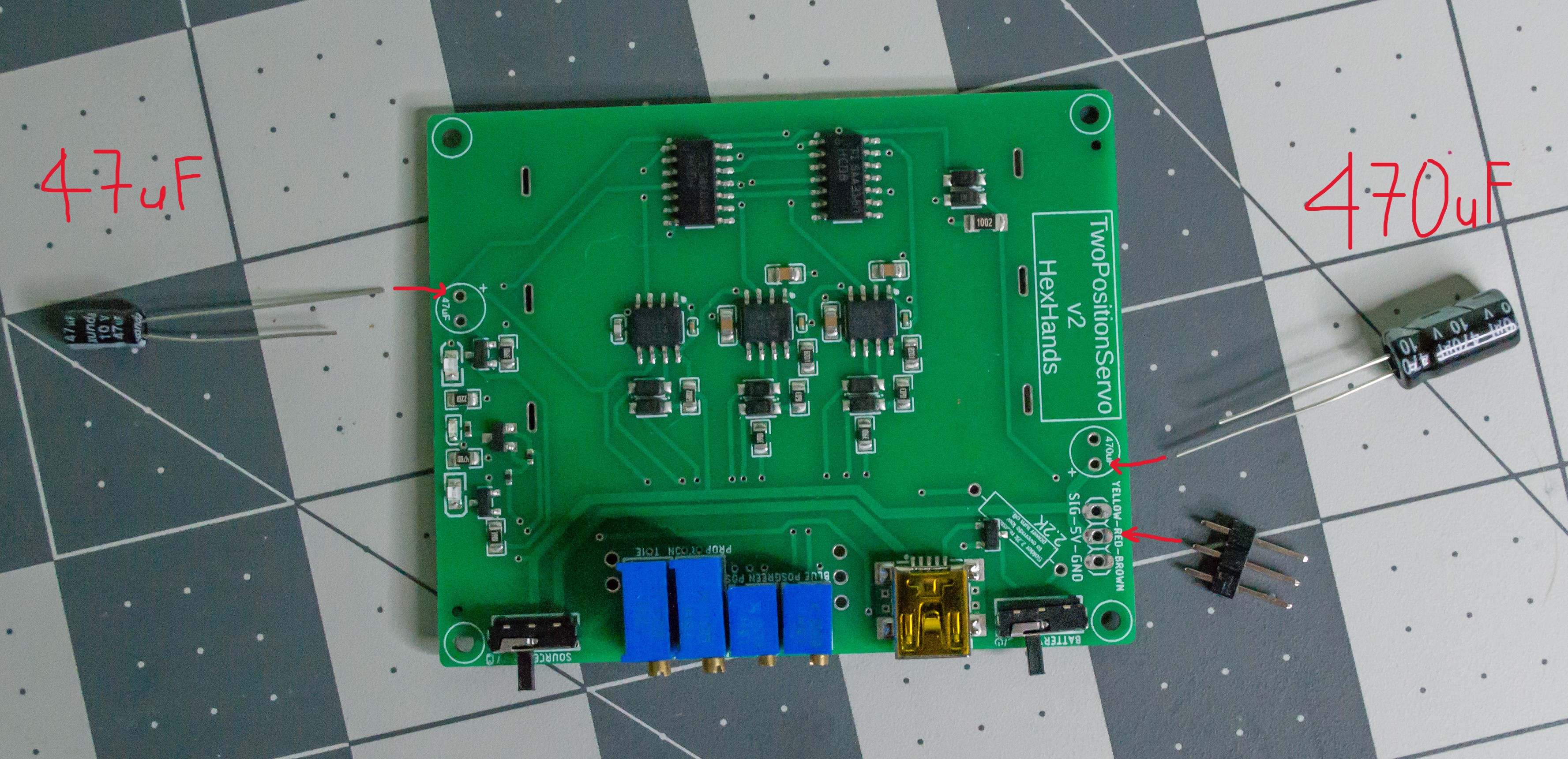 Annotated image of components and TwoPositionServo PCBA laid out.