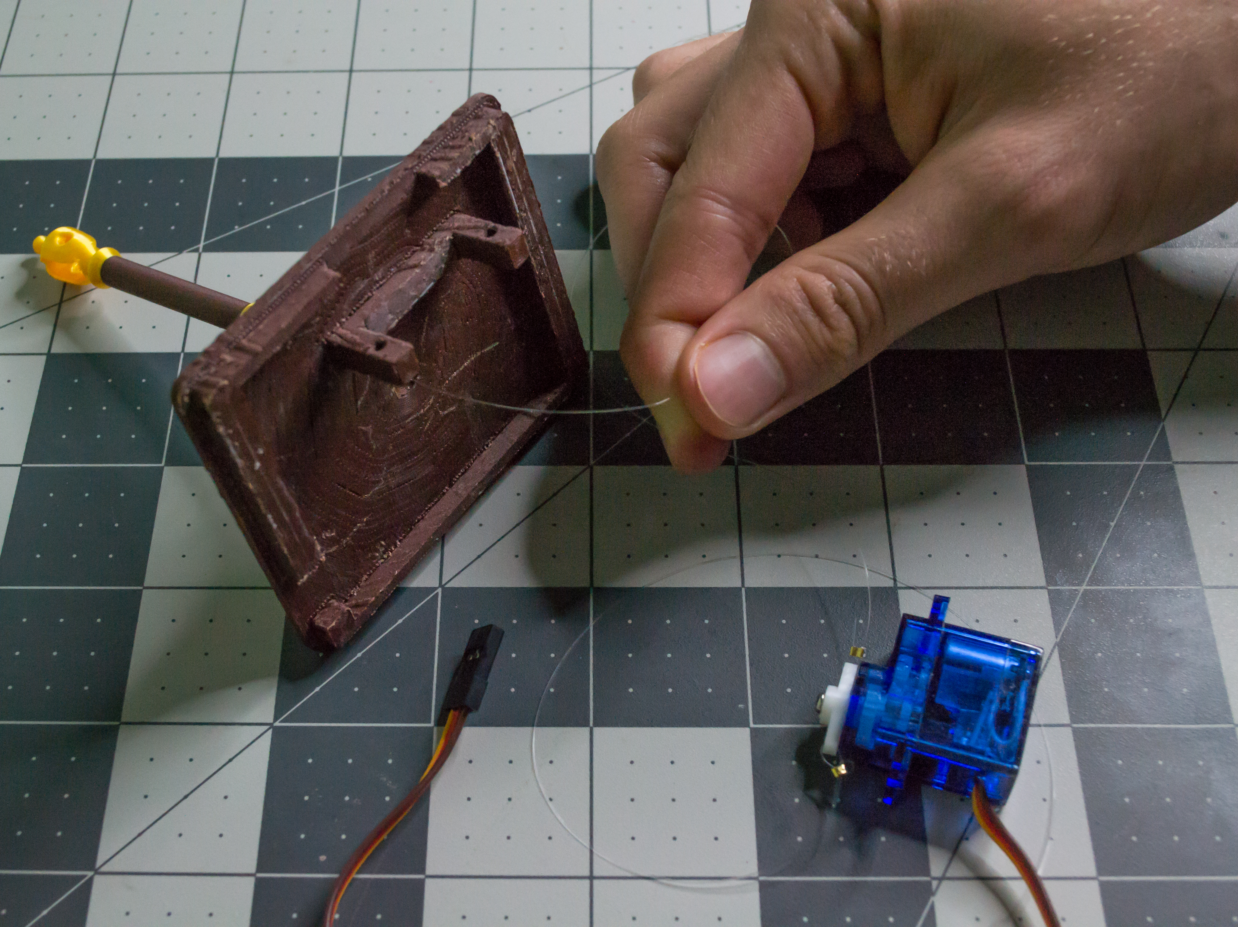 Pushing a monofilament line through the top component of VintageScale.