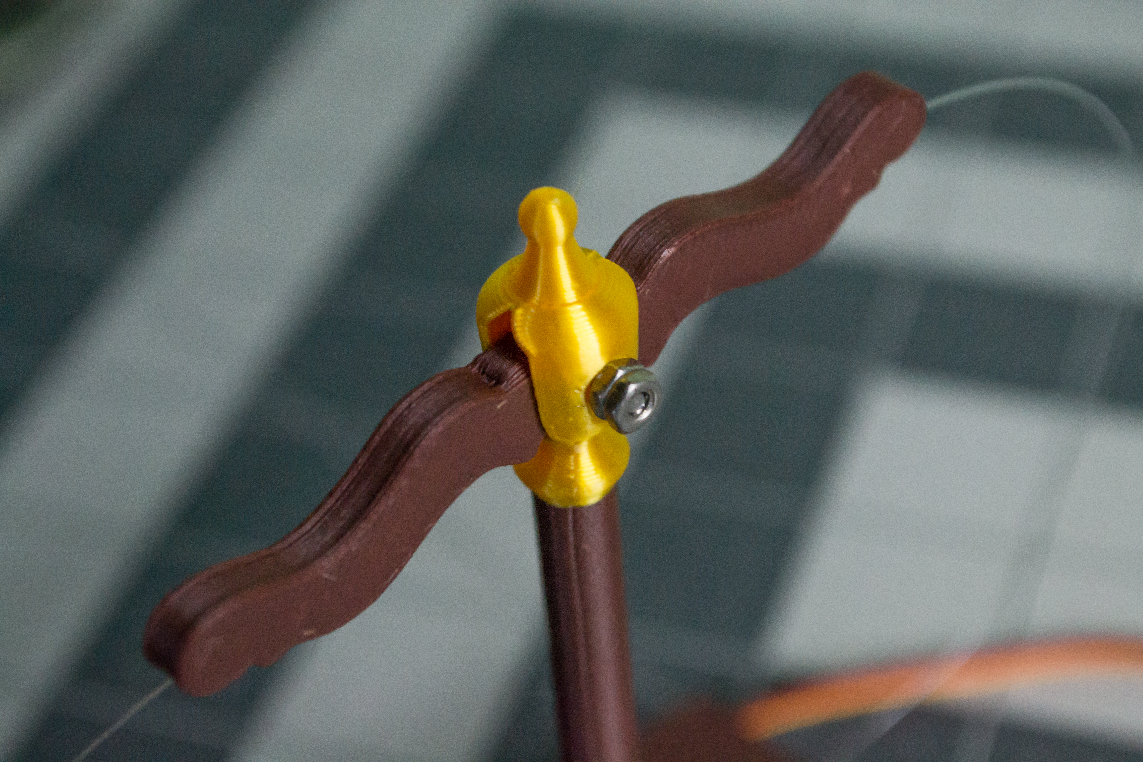 Using two M2 hex nuts to hold the M2, 16 mm fulcrum screw at the top of VintageScale in place.